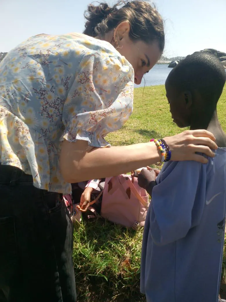 Stella speaking with child